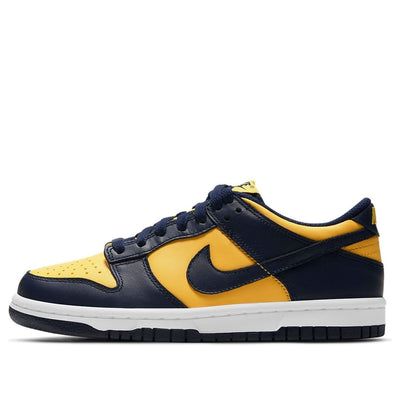 The Nike Dunk Low GS 'Michigan' is a special edition of the iconic 'Be True to Your School' series from 1985. This low-top version is offered in big kid sizing and pays homage to the Wolverines of Ann Arbor with an all-leather upper in Midnight Navy and Varsity Maize hues. The retro perforated toe box and lightly padded nylon tongue topped with a woven Nike tag are just some of the details that make this shoe so special. (SNKR/Skate/Low Top/Colorblock) Sporty Basketball Shoes With Logo Patch, Nike Sports Sneakers With Logo, Nike Sneakers With Logo For Sports, Nike Casual Team-colored Sneakers, Nike Collegiate Sneakers For Streetwear, Nike Throwback Custom Sneakers For Sports, Sporty Nike Team-colored Sneakers, Nike Sneakers In Team Colors For Sports, Casual Low-top Team-colored Basketball Shoes