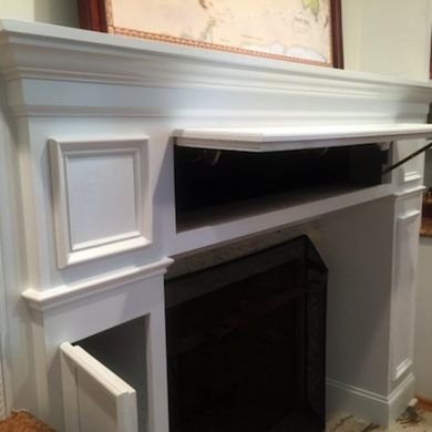 an empty fireplace is shown in the middle of a room with white paint on it