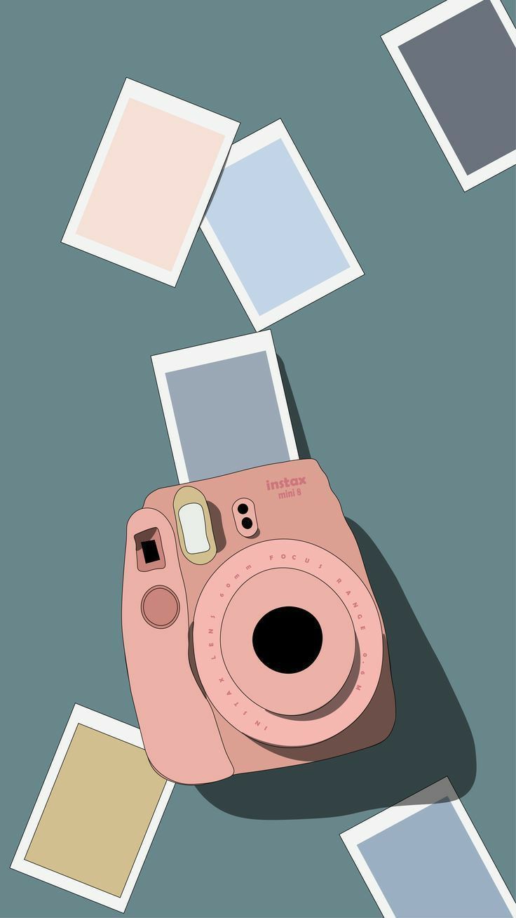 a pink camera sitting on top of a blue floor covered in polaroid frames and photos