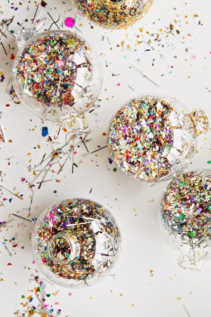 three wine glasses filled with confetti and sprinkles