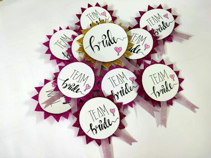 a bunch of badges that say team bride