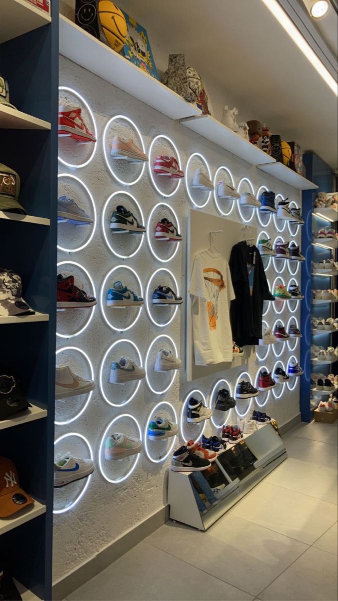 the inside of a shoe store with shoes on display