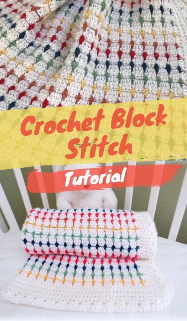 the crochet block stitch blanket is laying on top of a chair