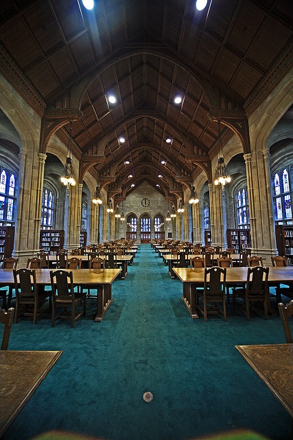 an empty library with tables and chairs in it