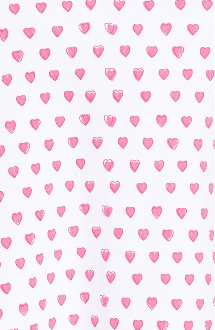 a white shirt with pink hearts on it