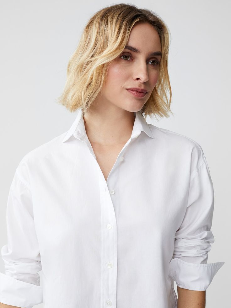 Worn by style icons of the past and present, there's something so timeless about a classic button-down shirt. Our newest addition to the line up is crafted in 100% cotton with a drop shoulder that's somewhere between structured and relaxed. For a menswear-inspired look, cuff the sleeves. | J.McLaughlin Women's Finn Shirt White, Size Medium | Cotton Timeless Button-up Tops With Placket, Classic Collared Shirt With Cuffed Sleeves, Modern Button-up Shirt For Daywear, Classic Collared Tops With Cuffed Sleeves, Classic Shirt With Shirttail Hem For Fall, Classic Tops With Rolled Sleeves For Fall, Classic Blouse With Rolled Sleeves For Business Casual, Classic Shirt With Rolled Sleeves For Fall, Timeless Fold Down Collar Top For Spring