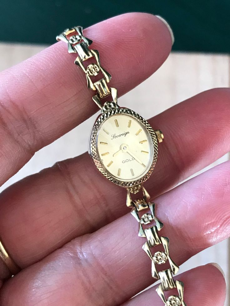 "🍀A Fine Antique Ladies Solid 9ct GOLD. 🍀9ct solid Gold bracelet.  🍀Winds and sets well and timekeeping Good.  🍀Serviced , Quartz  🍀9ct Case and 9ct gold watch band , full English hallmark  From 1970s  top cosmetics condition: 98%new(minty)  Case size 18-20mm including winding button. Collection grade! And daily wear  ship by Speed post worldwide* with no extra cost ^^ Why Vintage/ Antique jewelry & watches? 🌹Timeless Elegance:  offering a blend of vintage charm and functional sophistication. 🌹The unique and enduring appeal of owning a piece of history & heritage at your fingertips 🌹Each jewelry piece is a testament to meticulous craftsmanship, showcasing the natural brilliance the historical significance of designs.-Never scroll through online inventory at a sea of clones or copie Classic Oval Gold Watches, Oval Gold Watches For Gifts, Gold Oval Watches As Gifts, Gold Oval Watches For Gift, Gold Hallmarked Watches For Anniversary, Gold Oval Watches For Anniversary, Gold Antique Watch With Jubilee Bracelet, Antique Gold Watch With Jubilee Bracelet, Gold 14k Hallmarked Watches