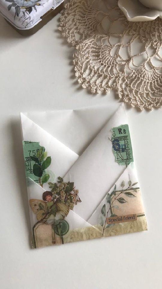 two napkins on top of a table next to lace doily and other items