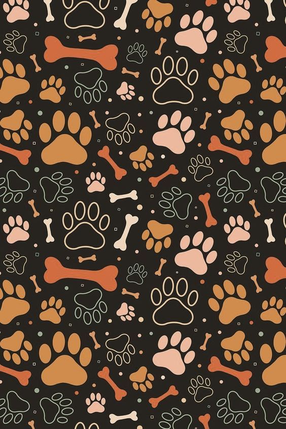 an animal paw and bone pattern on a black background with orange, pink, and brown colors