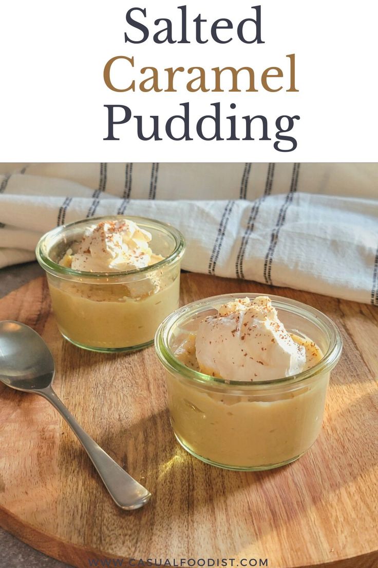 salted caramel pudding in small glass bowls on a wooden tray with spoons