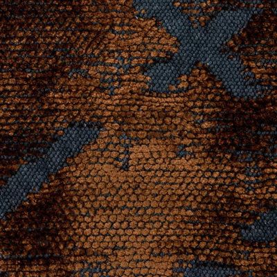 an orange and blue pattern on fabric