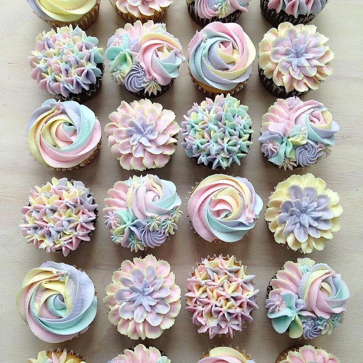 cupcakes decorated with pastel colors and flowers