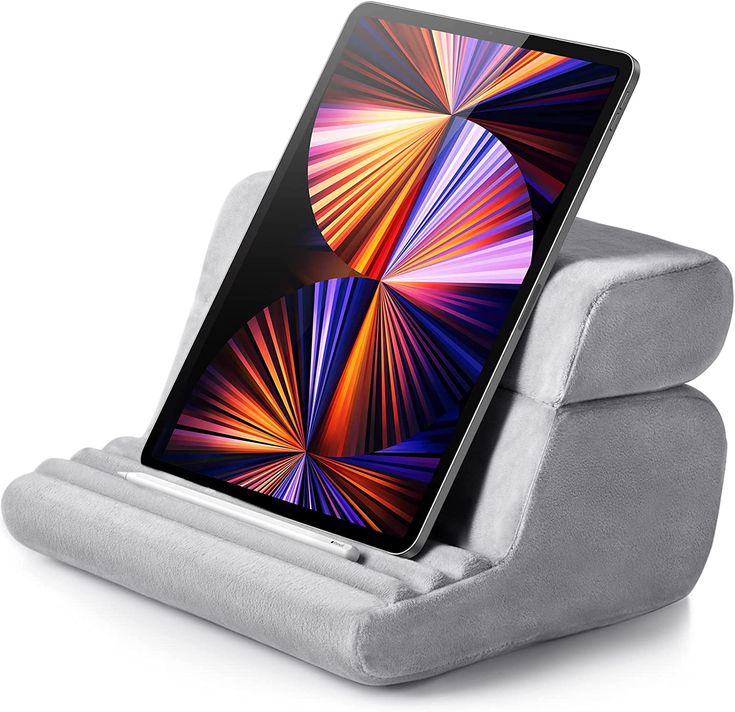 an ipad is sitting on top of a gray stand with a tablet in it's holder