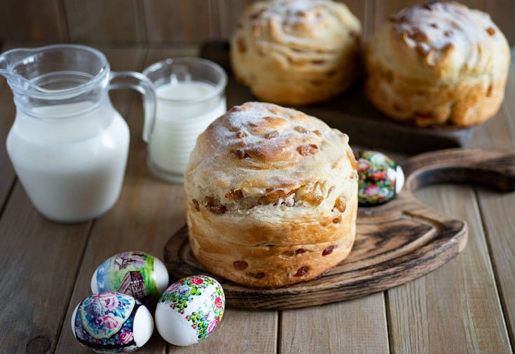 there are some breads on the table with eggs and milk in front of them