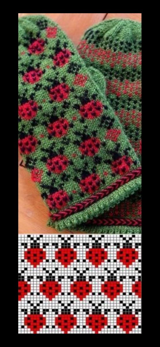 two green and red knitted mitts sitting on top of a wooden table next to each other