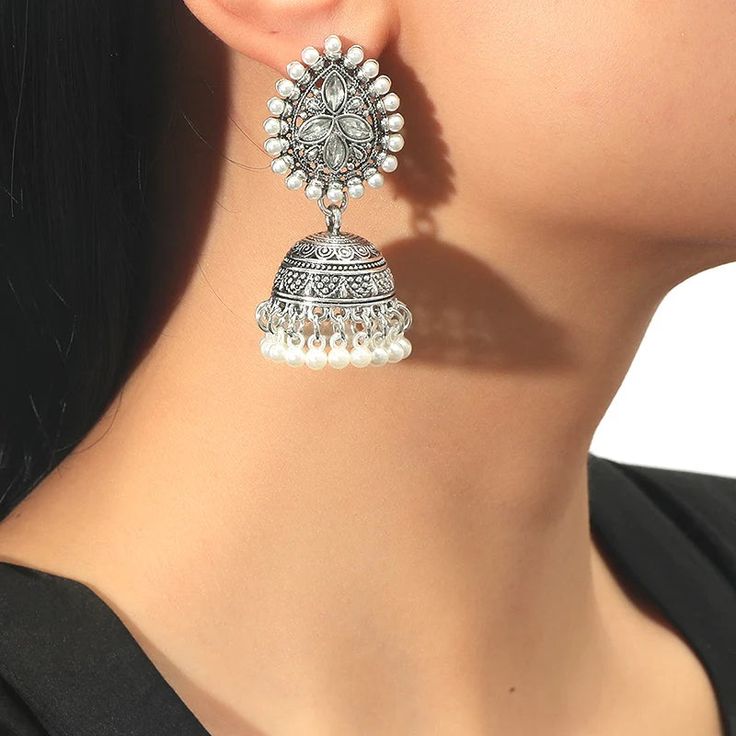 The versatile Cassie Jhumka Earrings are the ideal addition to any collection. Featuring just the right size and delicate details, these earrings can be dressed up or down to suit your style. Embrace their versatility and elevate any outfit with this must-have accessory. *This Product takes a Minimum of 30days to Ship* Traditional Chandbali Clip-on Earrings, Elegant Clip-on Earrings With Latkans, Festive Dangle Jhumkas, Festive Drop Earrings Danglers, Festive Single Earring, Chandbali Earrings With Latkans, White Pearl Drop Jhumkas, Drop Clip-on Earrings With Latkans, Festive Plug Earrings For Festivals