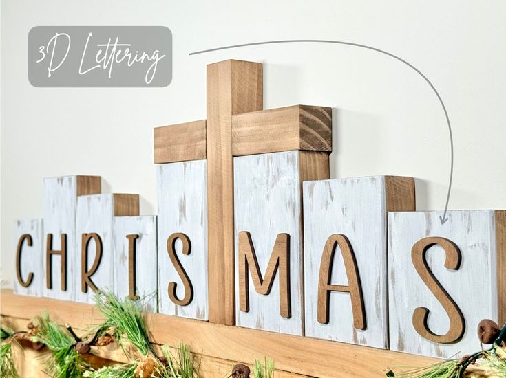 a wooden sign that says christmas on it