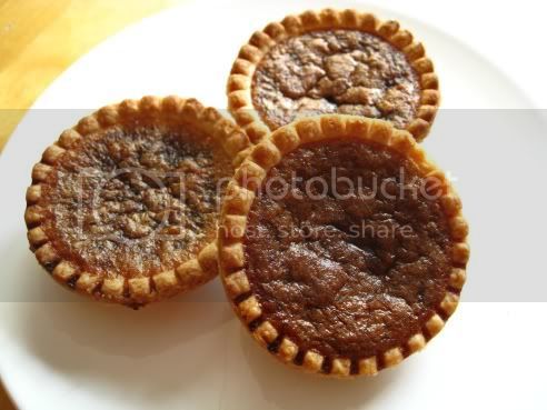 three small pies on a white plate