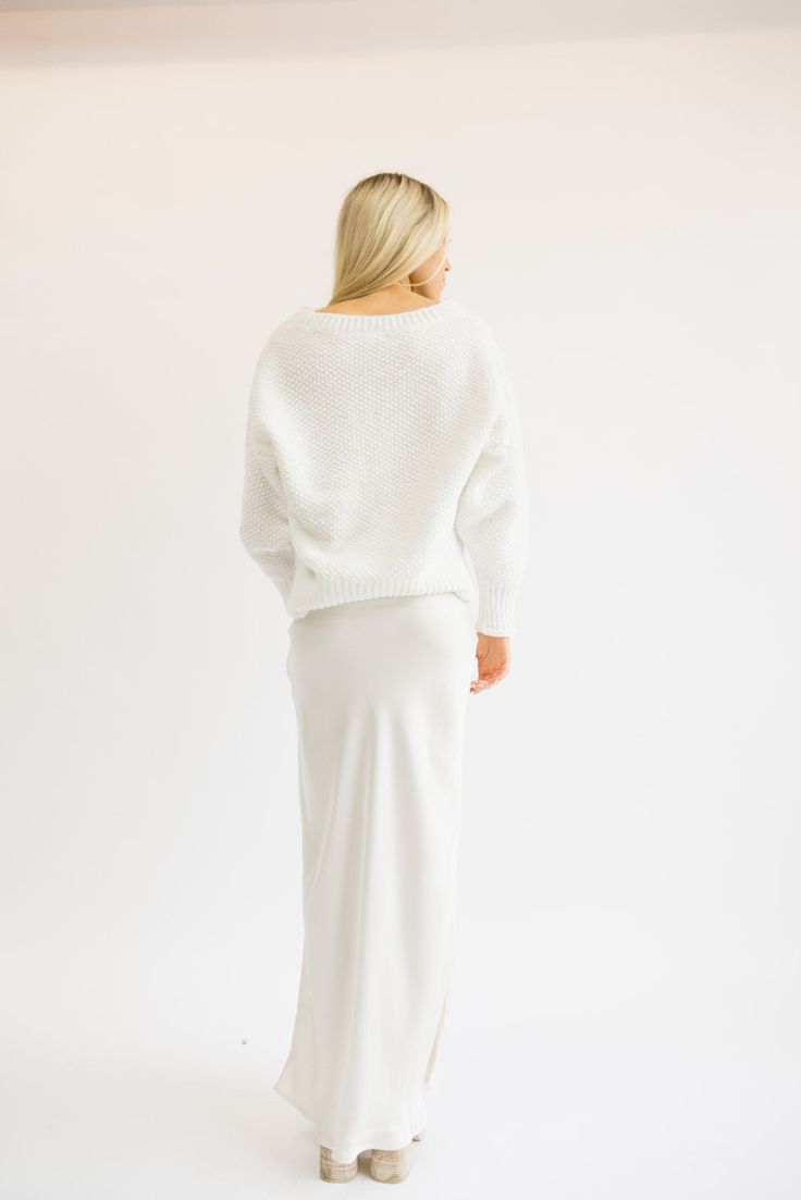 Just like its name - this sweater is SO SOFT. It feels so good on and is such a classic fit too! Everyone needs a white sweater like this one! Fits true to size being slightly oversized. Styled with our Ritzy Satin Midi Skirt. Model Info: Makena is 5’6 wearing size S/M. Chic White Long Sleeve V-neck Sweater, White Soft Knit V-neck Sweater For Layering, White Chunky Knit V-neck Sweater With Long Sleeves, White Knit V-neck Sweater With Ribbed Cuffs, Cozy White Sweater With Ribbed Cuffs, Cozy White Textured Knit V-neck Sweater, Cozy White Sweater With Relaxed Fit, White Knit V-neck Sweater For Layering, Chic White Sweater With Ribbed Cuffs