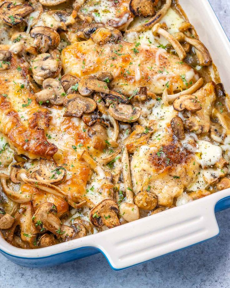 a casserole dish with chicken, mushrooms and cheese