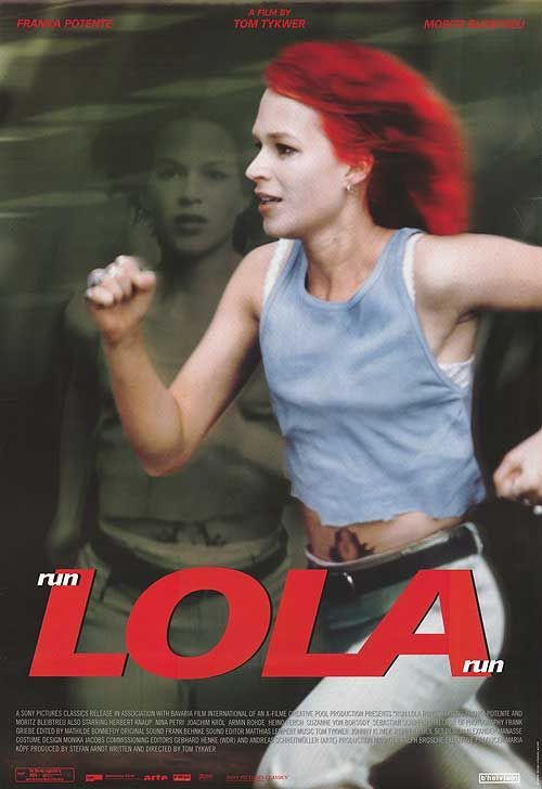 a woman with red hair running in front of a poster for the film lola