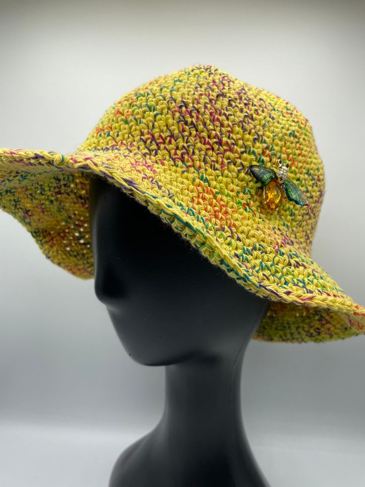 Stylish 100% cotton crocheted bucket hat.  Fits size 21-22 inches circumference.  Comes with a bee pin down on it.  Handwashing is recommended.  Lay flat to dry. Yellow Knitted Crochet Hat For Spring, Green Cotton Crochet Bucket Hat, Adjustable Cotton Crochet Hat, Adjustable One Size Cotton Crochet Hat, Handmade Yellow Cotton Hats, Yellow Cotton Sun Hat, One Size Fits Most, Casual Yellow Crochet Hat With Short Brim, Casual Yellow Crochet Sun Hat, Yellow Cotton Sun Hat