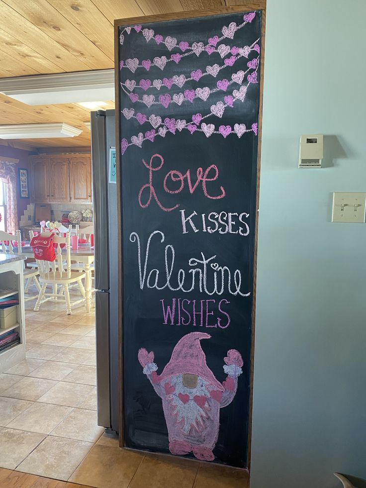 a chalkboard sign that says love kisses valentine wishes and an image of a gnome