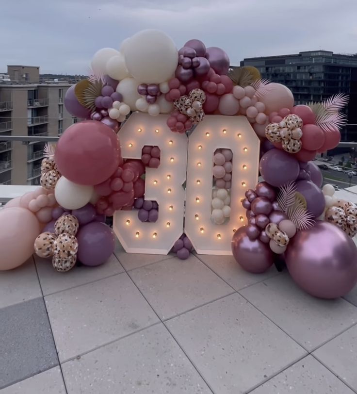 a large balloon arch with the number 50 surrounded by balloons