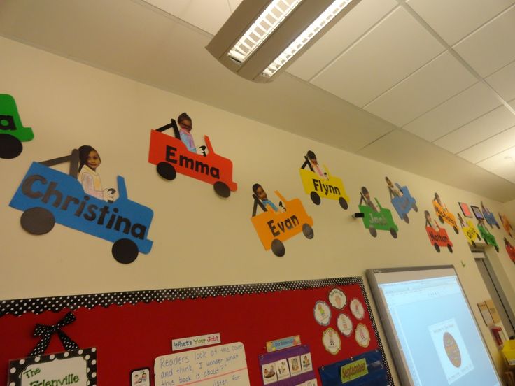 the children's room is decorated with colorful wall decals and pictures on the walls