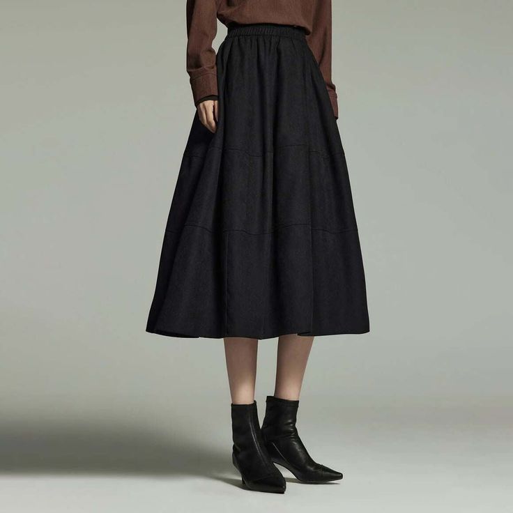 Chic Winter Essential Embrace the winter season in style with our Winter Elegance Women's Mid-Length A-Line Pleated Skirt. Perfectly blending fashion with comfort, this skirt is a must-have addition to your wardrobe. Its unique A-line silhouette and elegant pleat design create a flattering and sophisticated look for any occasion. Features That Impress Our skirt is crafted from high-quality twill fabric, ensuring both durability and comfort. The mid-calf length offers a perfect balance of modesty Non-stretch Midi Skirt For Fall, Chic A-line Winter Bottoms, Solid Maxi Skirt With Elastic Waistband For Fall, Maxi Skirt With Elastic Waistband For Fall, Chic Long Skirt Bottoms For Winter, Chic Winter Midi Skirt, Solid Color Gathered Maxi Skirt For Fall, Fall Solid Color Gathered Maxi Skirt, Solid Gathered Maxi Skirt For Fall