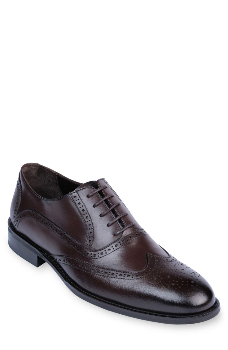 Handmade of smooth leather, this wingtip toe dress shoe with a classic oxford silhouette offers a sophisticated, elegant look. Leather upper and lining/synthetic sole Made in Turkey Classic Wingtip Oxford For Business Casual, Classic Wingtip Oxford Shoes For Business Casual, Classic Brogue-detailed Oxford Shoes For Semi-formal Occasions, Classic Brogue Oxford Shoes For Semi-formal Occasions, Classic Wingtip Oxford Shoes For Business, Classic Wingtip Oxford For Business, Classic Brogue Detailed Oxford For Formal Occasions, Classic Formal Oxford Shoes With Brogue Detailing, Classic Brogue Oxford Shoes For Formal Occasions