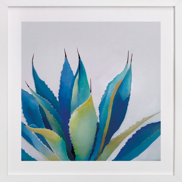 a painting of blue and green leaves on a white background