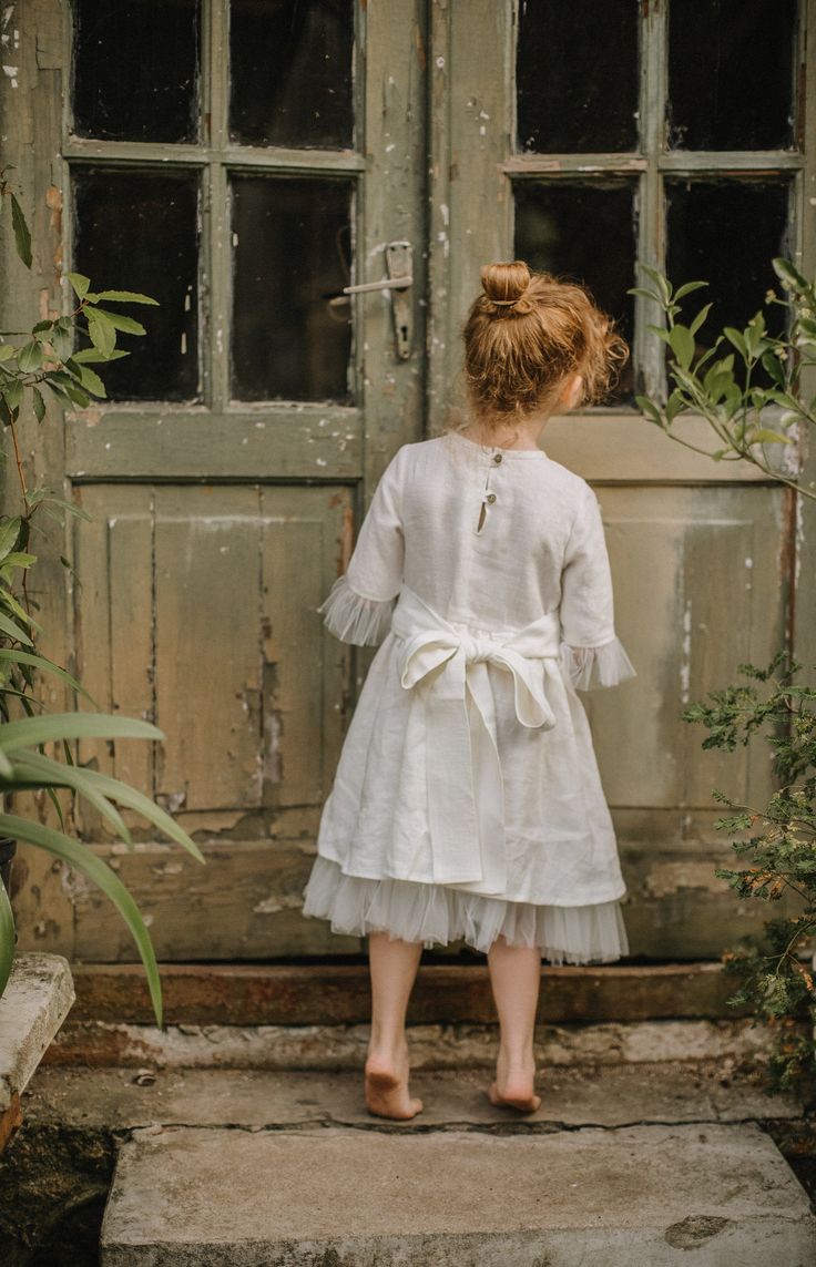 Baby girl's / toddler's white linen dress for wedding, birthday or christening party This wedding flower girl's linen and tulle dress with ribbon looks cute and is easy to wear. It is made of 100% natural organic washed linen and suitable for a child of any build. Clothes made of linen has amazing properties: in the hottest time of the year - cools, in a cool - warms. Do not electrified and not contaminated as fast as cotton. DETAILS: ♥ White linen dress for girls ♥ 100 % European linen fabric, White Baptism Dress, Wedding Flower Girls, Flower Girl Dresses Vintage, Toddler Birthday Dress, Dress With Ribbon, Girls White Dress, White Flower Girl Dresses, Wedding Girl, White Linen Dresses