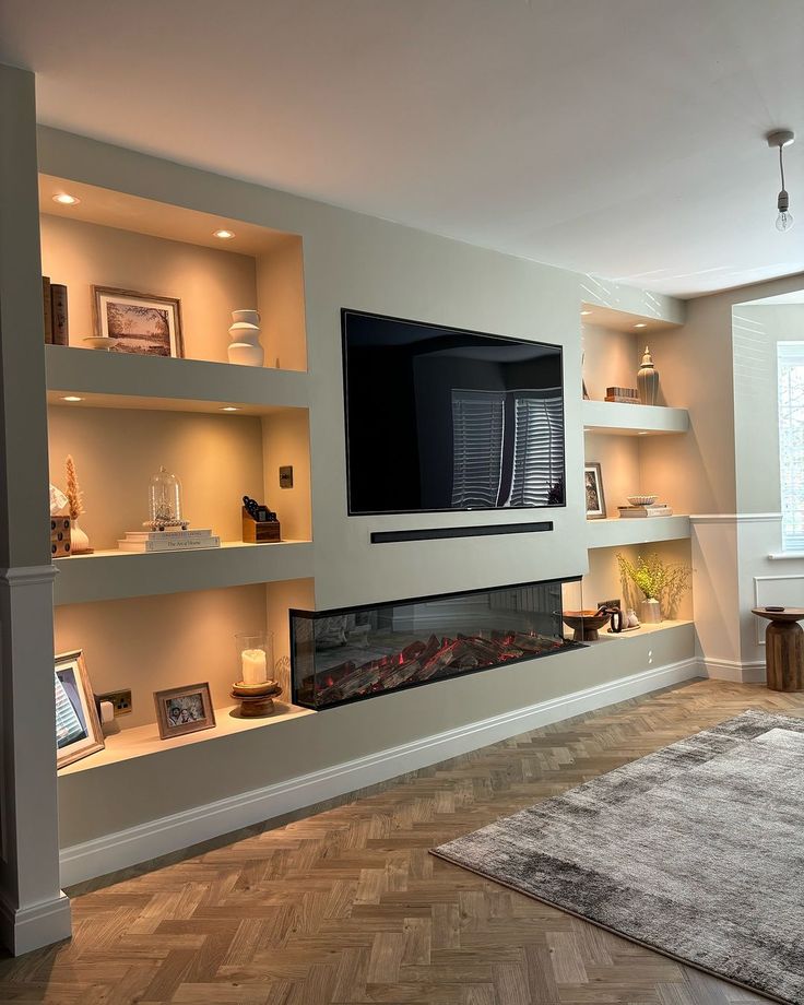 a large flat screen tv mounted to the side of a wall in a living room