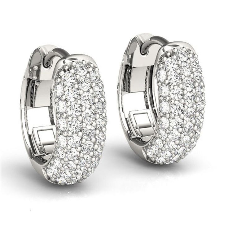 Sparkling diamonds are placed in this new pair of huggie earrings. They're set in 14k white gold with 1.25 ct of round diamonds. An excellent quality prong setting showcase the stones beautifully on the inside and outside of the pair. We offer a 30 - day return policy with this magnificent pair of earrings. Earring Information: BackingPost  RhodiumYes FitComfort Number of Diamonds72 Total Carat Weight1.25ct ColorG ClaritySI1 CutExcellent ShapeRound SymmetryExcellent EnhancementNone(Natural) PolishExcellent Setting Prong Setting Appraisal/CertificateYes Edelweiss Jewelry, White Gold Hoop Earrings, Pave Diamond Earrings, Diamond Huggie Earrings, Silver Diamond Earrings, Engagement Earrings, Diamond Huggies, White Gold Hoops, Diamond Hoop Earrings