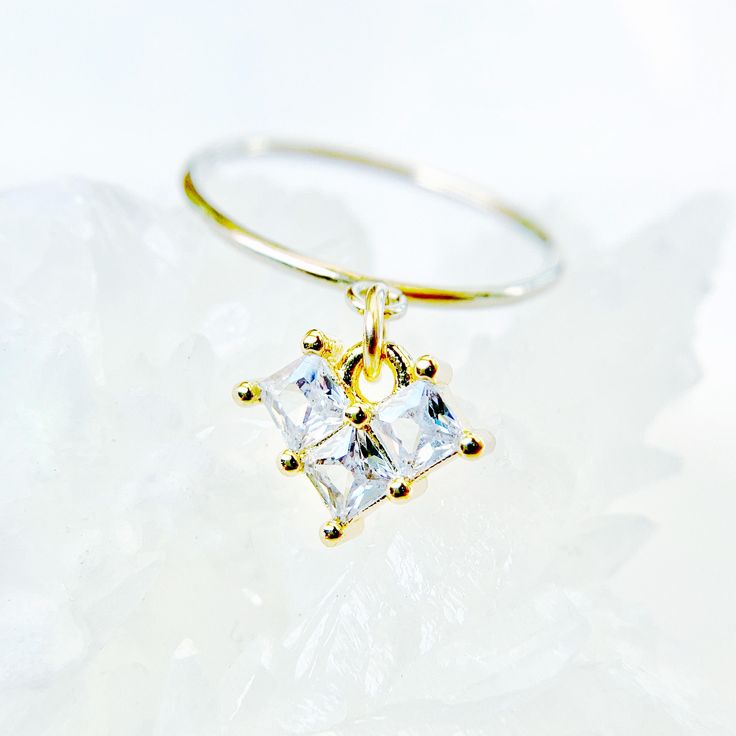 This 14k gold-filled heart ring is a dainty piece of everyday jewelry featuring cubic zirconia gemstones, perfect as a women's anniversary gift or a romantic gesture for your girlfriend. The delicate design makes it an ideal stackable promise ring, combining the elegance of a 14k gold-filled band with the sparkle of cubic zirconia, creating a versatile and meaningful accessory for various occasions. ✦  Elegant and Versatile: The Perfect Expression of Love and Commitment      *  14k gold filled ring with a heart-shaped charm adorned with four cubic zirconia stones      *  Available in sizes 4-8 with band options: 2mm textured, 2mm smooth, or 1mm thin      *  Suitable for everyday wear, special occasions, or as a promise, engagement, or stackable ring      *  Comes in a choice of blue, turqu Dainty Birthstone Ring With Diamond Accents In Cubic Zirconia, 14k Gold Midi Rings With Diamond Accents As Gift, White Gold Cubic Zirconia Midi Rings As Gift, Dainty Cubic Zirconia Birthstone Ring For Anniversary, Yellow Gold Midi Rings With Diamond Accents As Gift, Stackable Cubic Zirconia Midi Rings As A Gift, Delicate Diamond White Stackable Rings For Gifts, Dainty Heart Ring With Cubic Zirconia As Gift, Dainty Cubic Zirconia Midi Rings For Anniversary