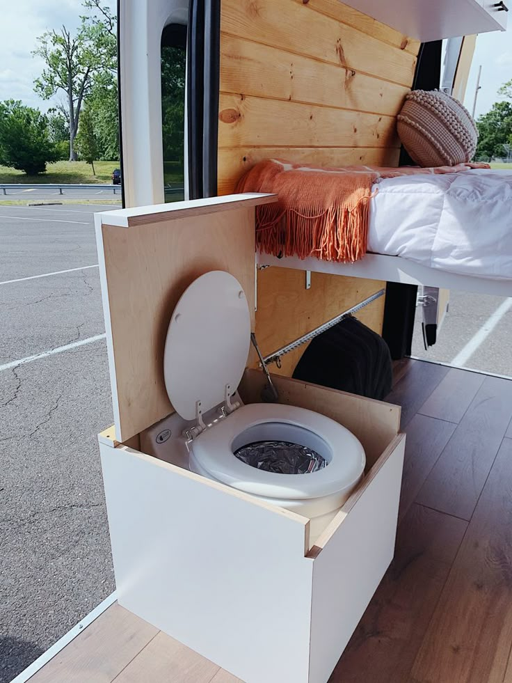 an open toilet in the back of a camper