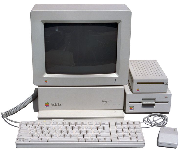 an old apple computer with keyboard and mouse