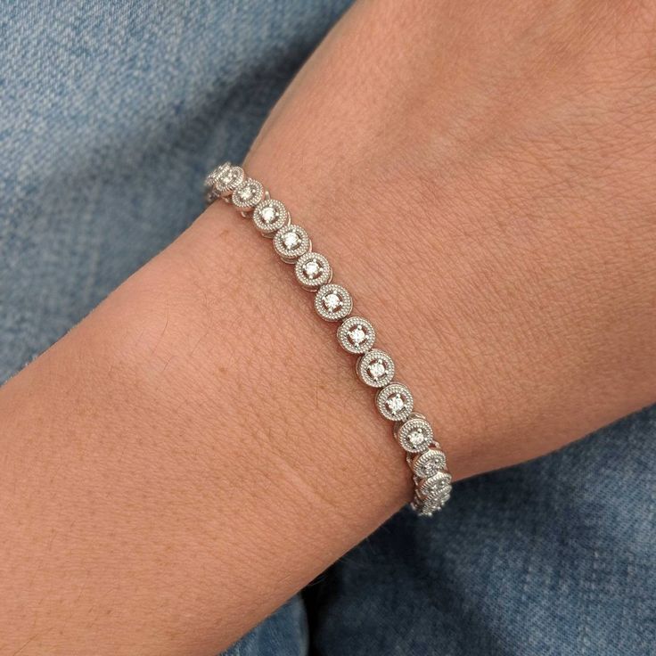 We took a classic tennis bracelet and added vintage charm with delicate milgrain detailing. The bracelet is finished with a box clasp with locking hinge for added security. This bracelet is fully customizable. If you prefer 18k gold or platinum, different dimensions, different quality diamonds or moissanites or colored gemstones, please contact us: http://etsy.me/1231fkN Details: - Solid 14k yellow or white gold - Bracelet is 7 inches in length. For different lengths, please contact us. - SI+G/H Formal Diamond White Tennis Bracelet With Bezel Setting, Elegant Diamond White Tennis Bracelet With Bezel Setting, Elegant Tennis Bracelet In Diamond White With Bezel Setting, Timeless Diamond Tennis Bracelet With Bezel Setting, Elegant Platinum Tennis Bracelet With Diamond Cut, Luxury Silver Tennis Bracelet With Bezel Setting, Wedding Tennis Bracelet With Bezel Setting Cubic Zirconia, Wedding Cubic Zirconia Tennis Bracelet With Bezel Setting, Classic Jewelry With Single Cut Diamonds