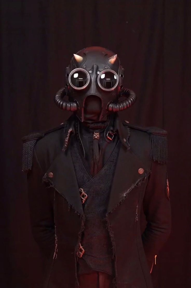 a man in a suit and mask with horns on his head, standing against a black background