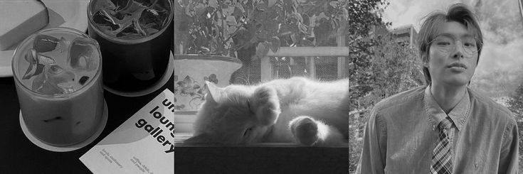 a black and white photo of a man with a cat