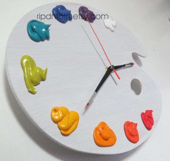 a clock with different colored paint on it