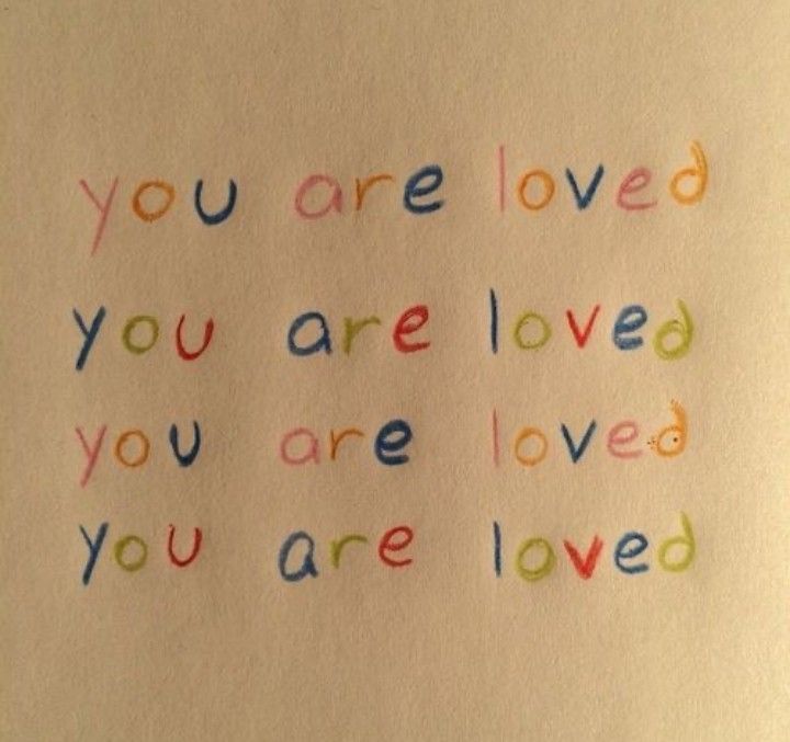 the words you are loved and you are loved written in colored crayons on white paper