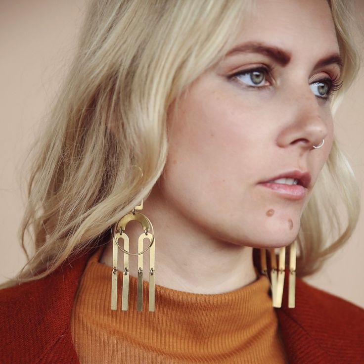 Model wearing bright brass Joni statement earrings comprised of modern brass shapes stacked and connected with jump rings creating a chandelier effect. Long Chandelier, Chandelier Style, Match Making, Brass Earrings, Everyday Jewelry, Statement Jewelry, Ear Wires, Statement Earrings, Handmade Jewelry