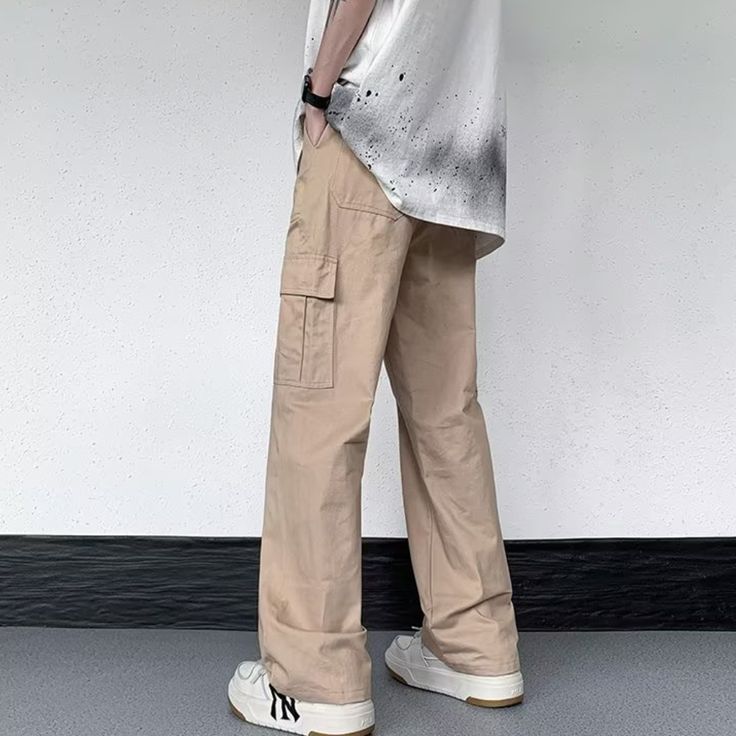 Our Casual Literary Straight Cargo Pants are an essential piece for any stylish look. Boasting a sophisticated solid color and deep pocket detail, these premium pants are the perfect balance of casual and literary. Ideal for any occasion, you'll feel both comfortable and confident in these urban-chic trousers. Features: -100% Cotton -Mid-rise waist -Solid Color -Straight Leg -Regular Fit -Casual style Casual Cargo Pants With Patch Pockets, Casual Straight Leg Cargo Pants With Multiple Pockets, Straight Leg Chinos With Cargo Pockets For Streetwear, Casual Full-length Dress Pants With Welt Pockets, Baggy Cargo Pants In Solid Color, Urban Chinos With Pockets For Streetwear, Wide Leg Cargo Parachute Pants, Relaxed Fit Solid Dress Pants With Side Pockets, Solid Color Pants With Patch Pockets For Streetwear