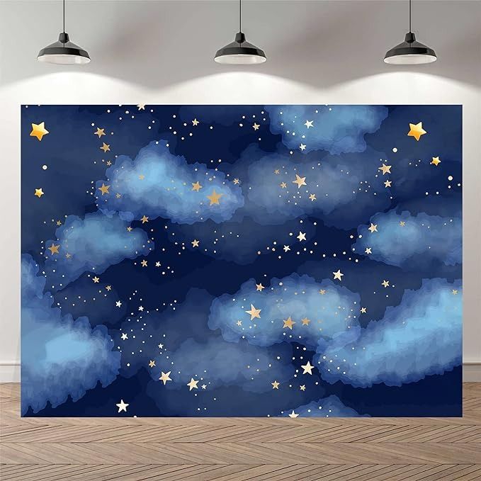 a wall mural with stars and clouds in the night sky