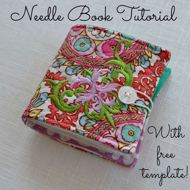 a small book is sitting on top of a white tablecloth with the words needle book journal written below it