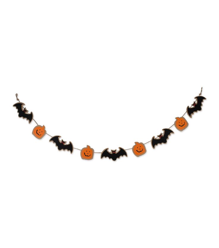 a halloween garland with bats and pumpkins hanging from it's sides on a white background