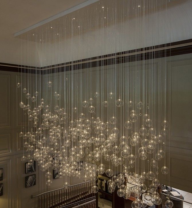 a chandelier hanging from the ceiling in a room