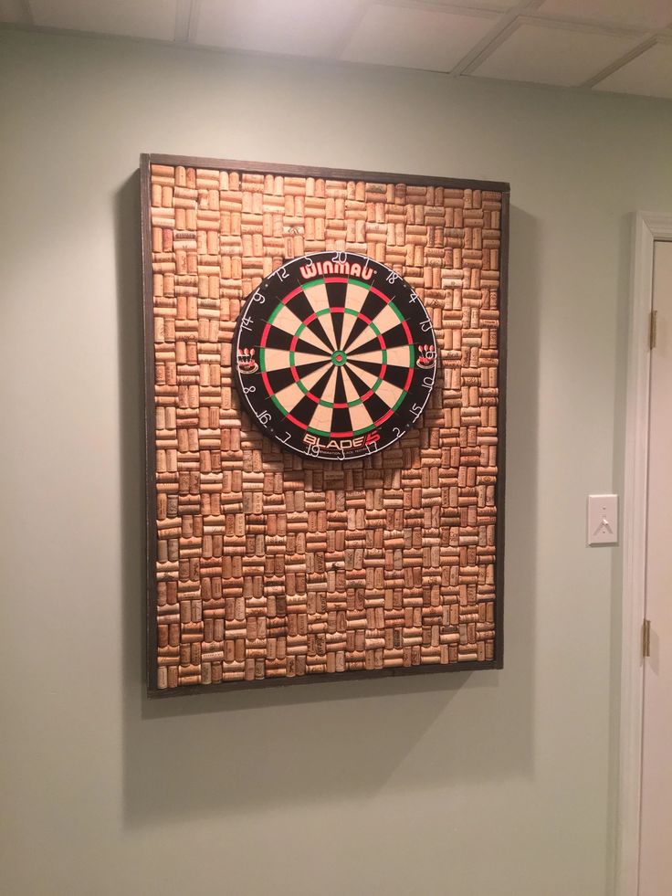 a dart board mounted to the side of a wall